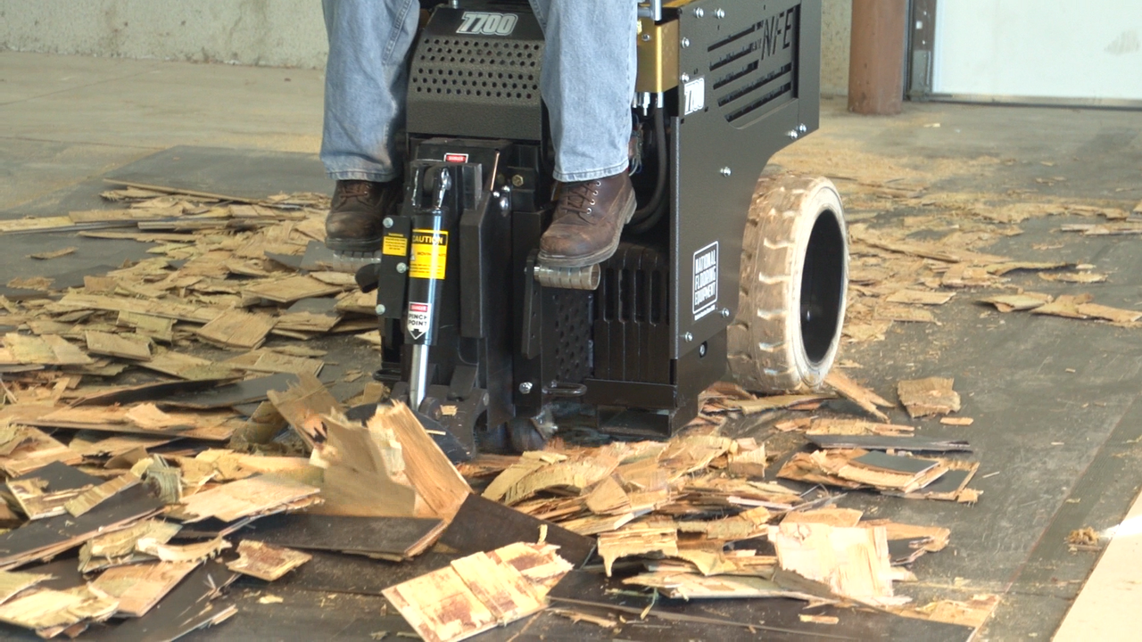 Scraper removing hardwood floor